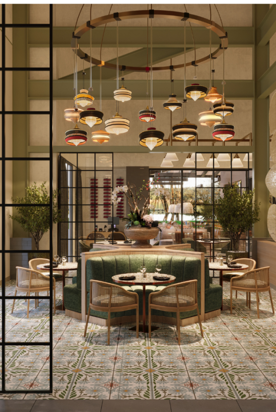 A stylish restaurant interior with glass-panel doors, warm lighting, round tables, greenery in large planters, and a decorative chandelier above a central seating area.